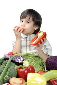 Cute kid with healthy food.